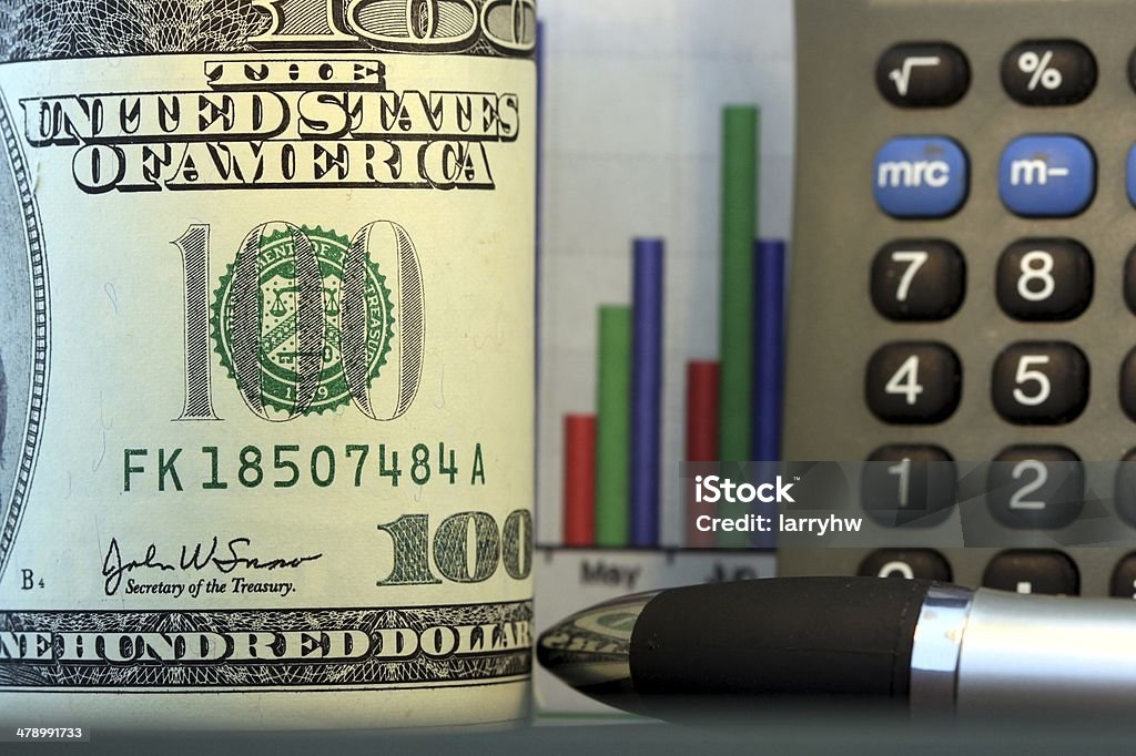 Sales Chart and US Currency One Hundred Dollar Bills Business growth financial charts with American currency Budget Stock Photo