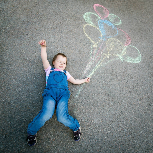 istock Little Girl with balloons 478992062