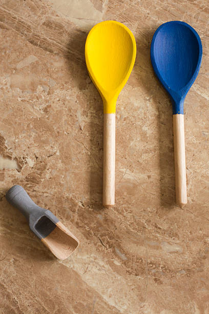 istock red yellow blue and green wooden spoons 478992156
