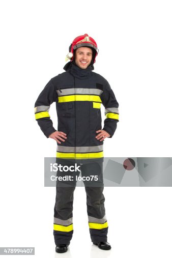 istock Cheerful fireman posing. 478994407