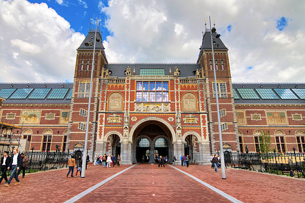 New National state museum Amsterdam, The Netherlands - June 25, 2013: People walking around the renovated National state museum on the Museumsquare in Amsterdam, the Netherlands, on June 25, 2013. image created 21st century blue architecture wide angle lens stock pictures, royalty-free photos & images