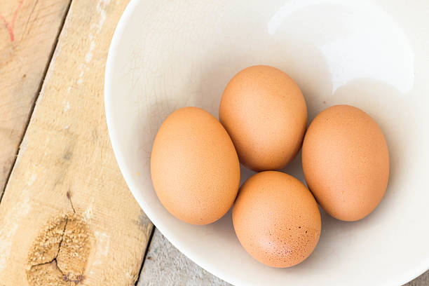 istock chicken eggs on towel and bowl 478996300