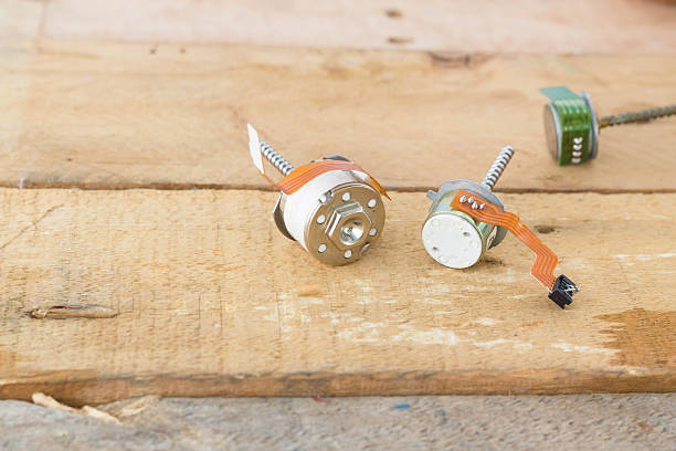 istock old small stepper motor and power cord on wood 478996324