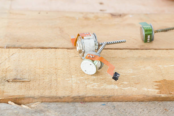 istock old small stepper motor and power cord on wood 478996326