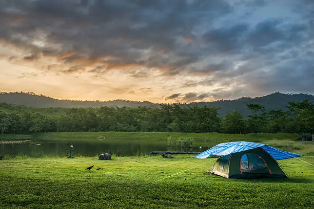 Tourist tent in camp among meadow in the National park.