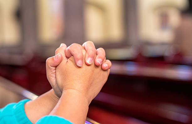 people praying in church