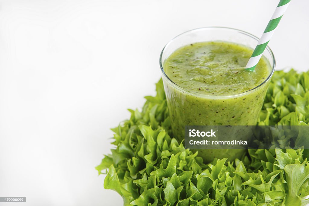 Fresh organic green smoothie with salad, apple, cucumber, Fresh organic green smoothie with salad, apple, cucumber, pineapple and lemon as healthy drink Color Image Stock Photo