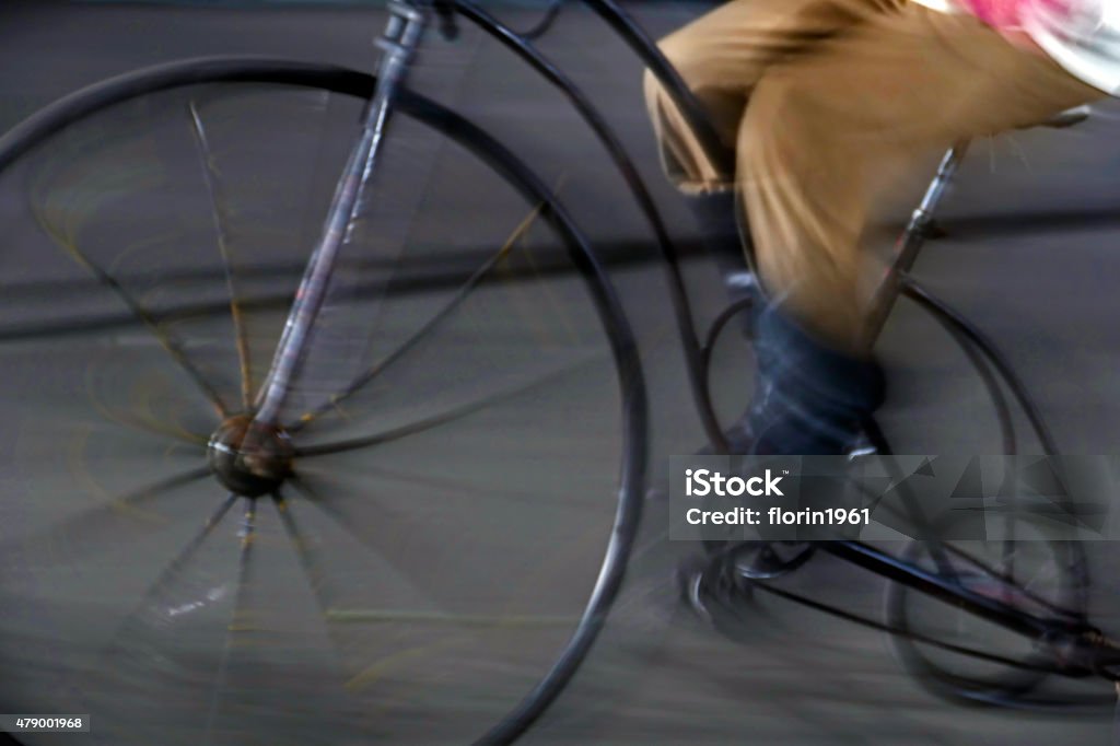 Bike man, with one old-bike, on blurred background Abstract image with a moving bike man, with one old bike, on blurred background. 2015 Stock Photo