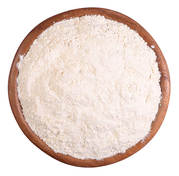 istock White flour in a wooden bowl on a white 479002700