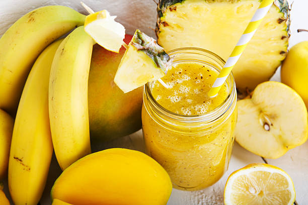 istock Fresh organic yellow smoothie with banana, apple, mango, pineapple 479003167