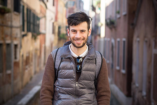 Happy young man in Venice at day