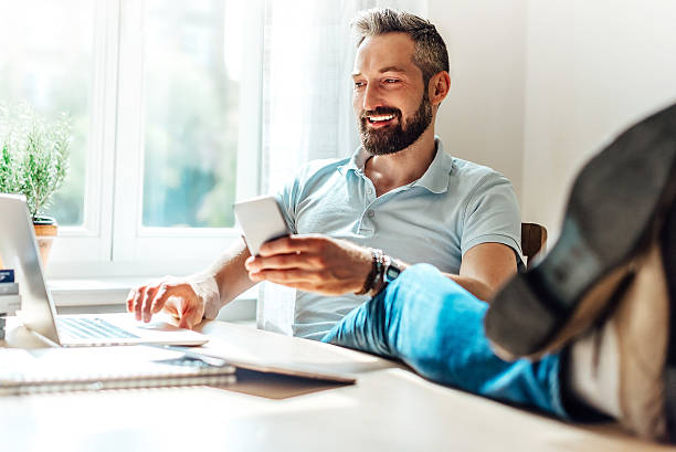 istock lucky bearded man makes business in the web 479009906
