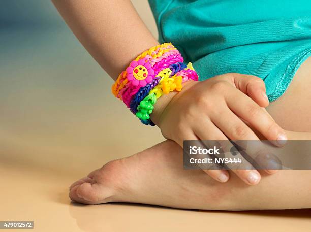 Loom Bracelets On Child Hand Close Uprubber Colorful Wrist Accessories Stock Photo - Download Image Now