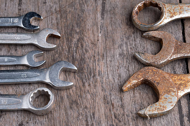 istock Wrench with nuts and bolt on wood table 479013312