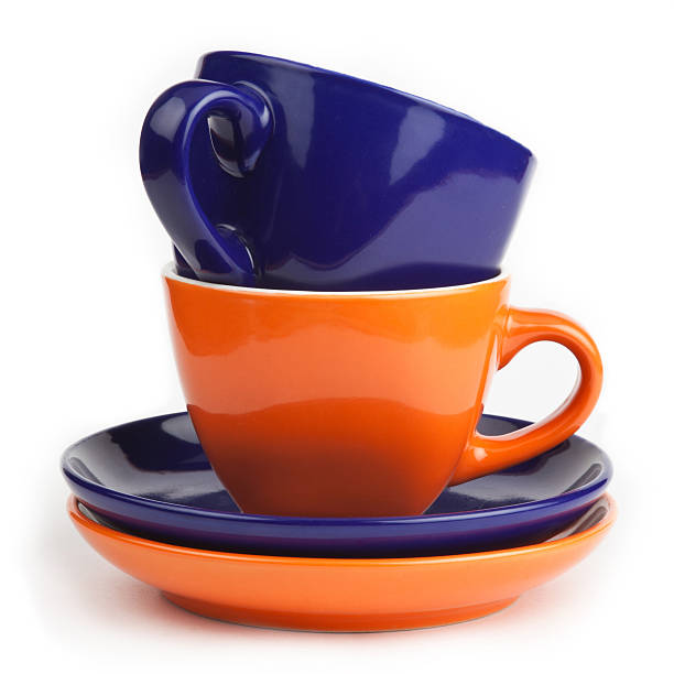 istock stack of blue and orange tea cups and saucers 479016701