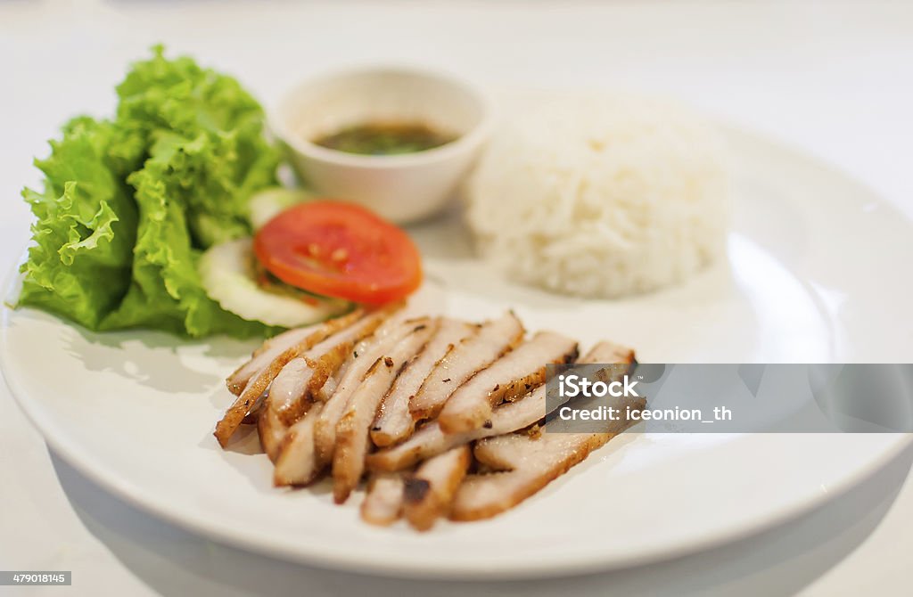 Pork Adobo with Rice Pork prepared in soy sauce, vinegar, and spices. Served over steamed white rice. Asian Culture Stock Photo
