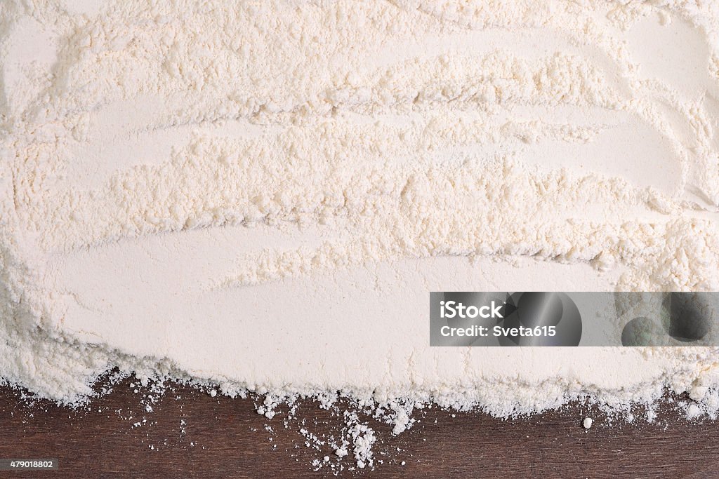 White flour on a wooden background White flour on a wooden background close up 2015 Stock Photo