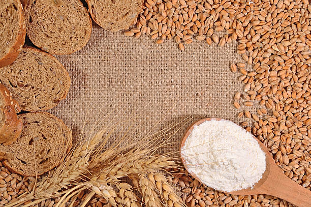 istock Frame of white flour, wheat and bread 479019116