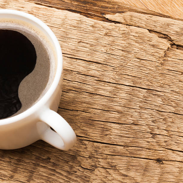 istock Black coffee cup on old wooden table 479020208