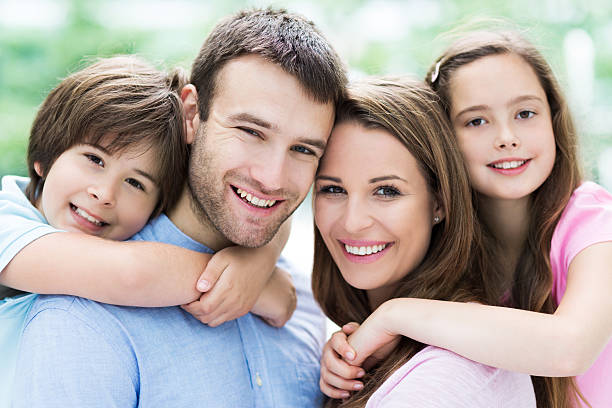 istock Parents giving kids piggyback ride 479026834