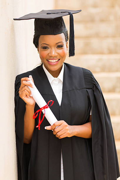 istock afro american graduate holding diploma 479029842