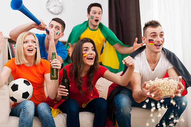 istock Multicultural friends watching a football game 479030689