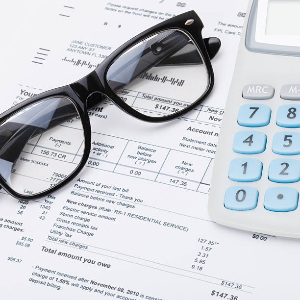istock Calculator and glasses with utility bill - close up 479032560