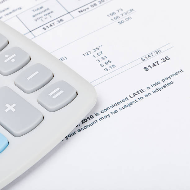 istock Calculator with utility bill - close up studio shot 479032636