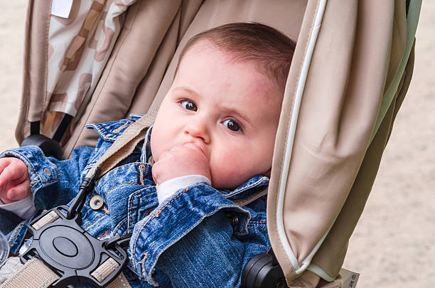 Little child baby in a pram stock photo