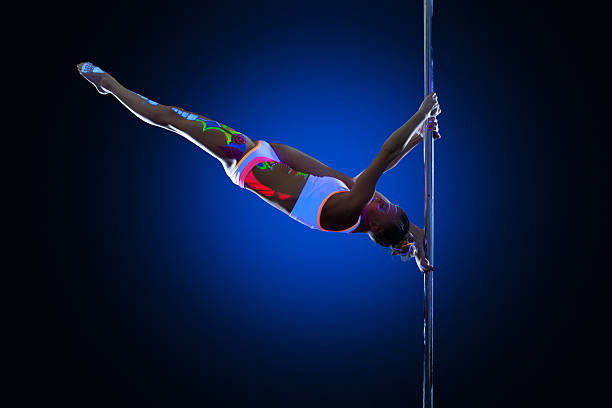 istock Athletic young woman posing doing splits on pylon 479039463