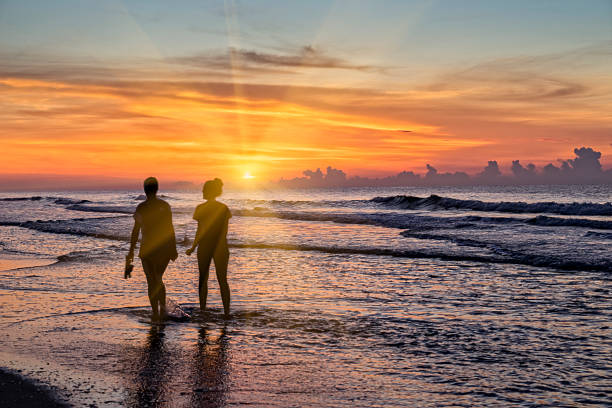 Early morning beach activity in a happy vacation scene in Myrtle Beach, SC.