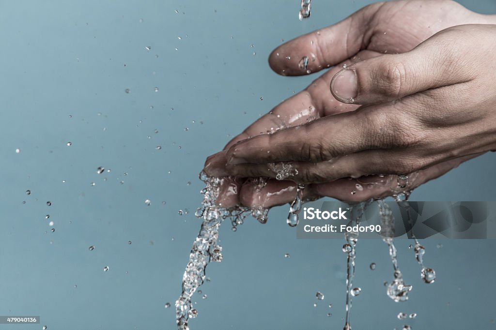 wet hands Water flows in the hand 2015 Stock Photo