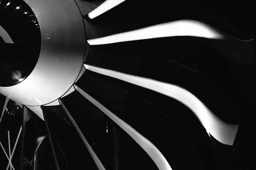 Close-up of a turbofan jet engine in modern airplane. Monochrome