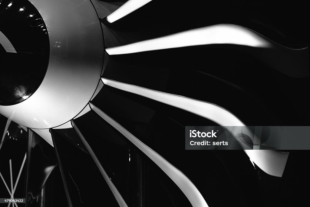 Turbine Blades of An Aircraft Jet Engine Close-up of a turbofan jet engine in modern airplane. Monochrome Aerospace Industry Stock Photo