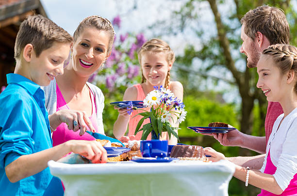 istock Family having coffee and cake in garden 479043644