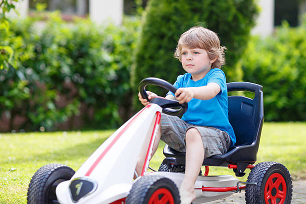 istock Active little boy having fun and driving toy race car 479054470