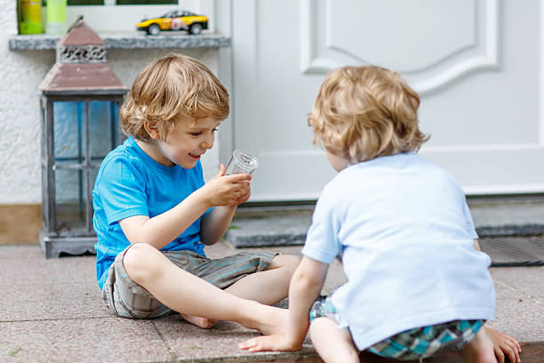 istock Two happy sibling boys having fun together outdoors 479054478