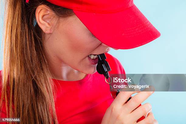 Lifeguard On Duty Blowing A Whistle Stock Photo - Download Image Now - Whistle, Females, 2015