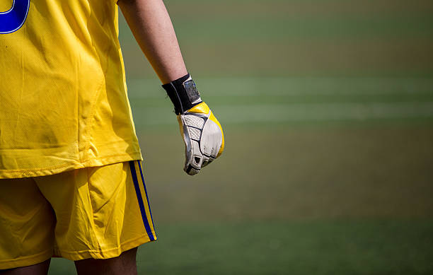 istock goal keeper's hand with glove 479054696
