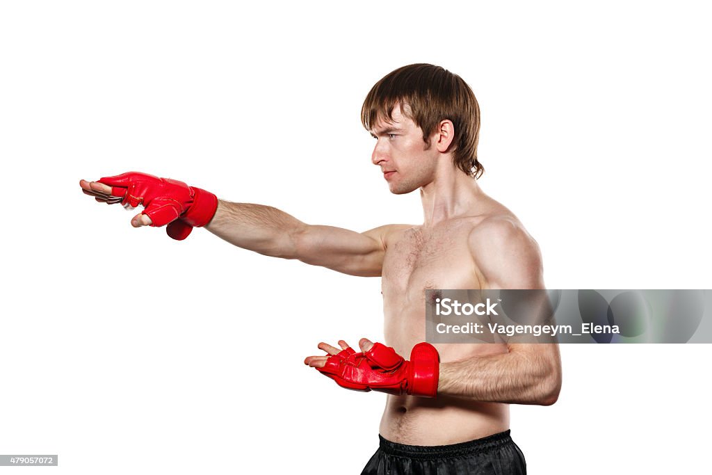 Fighter Kung Fu strike directly Male fighter kung fu strike directly. Isolated on white background. The concept of martial arts. 2015 Stock Photo