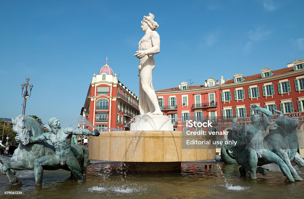 Nice - Fountain Soleil Nice, France - May 2, 2013: Fountain Soleil on Place Massena. Square is located in the city center and is the most popular destination among tourists. The square was reconstructed in 1979. There are many boutiques, cafes and restaurants. 2015 Stock Photo