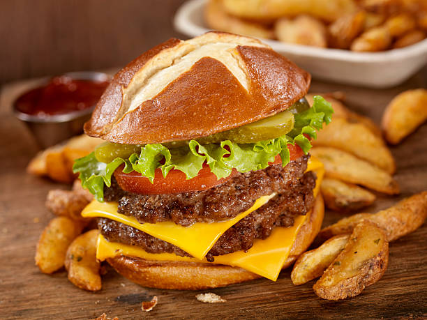 i pretzel hamburger - symmetry burger hamburger cheese foto e immagini stock