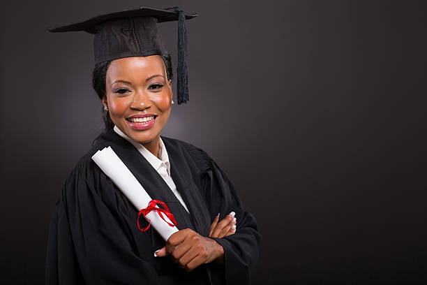 istock young african american graduate holding diploma 479067412
