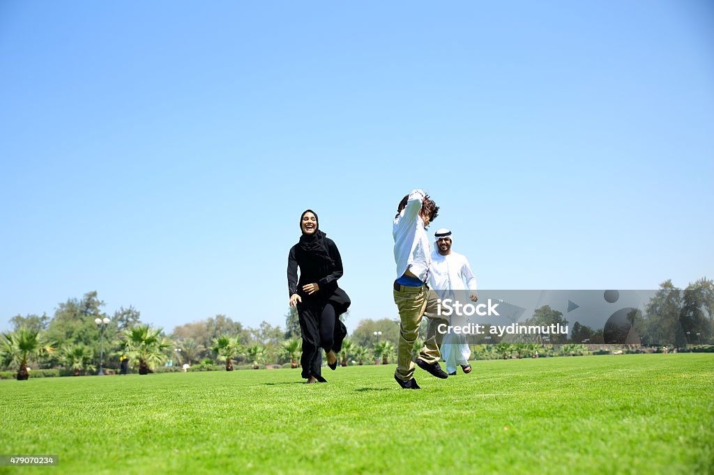 Arab Emirati family outdoors in park Arab Emirati family outdoors in park. 2015 Stock Photo