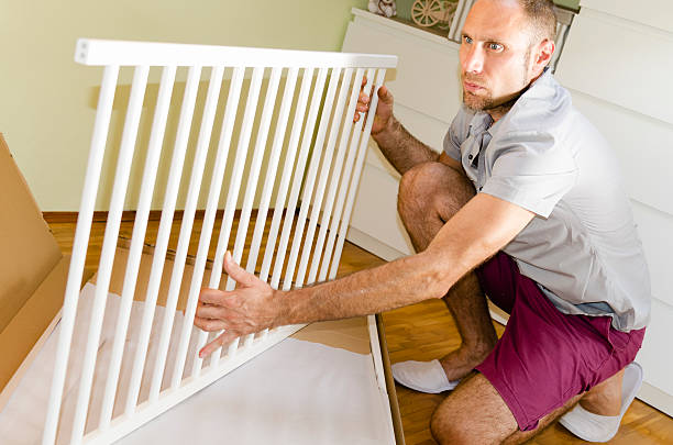 istock Men preparing baby room 479073054