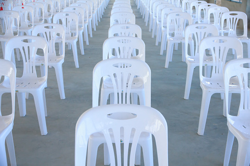 White plastic chairs in celebration and indoor event