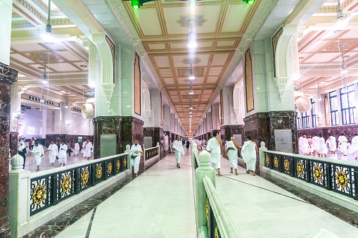 Mecca, Saudi Arabia - March 13, 2015: Muslim pilgrims perform saei (brisk walking) from Safa mount from Marwah mount in Mecca. Muslim pilgrims perform 7 rounds of saei from Safa mount to Marwah mount.