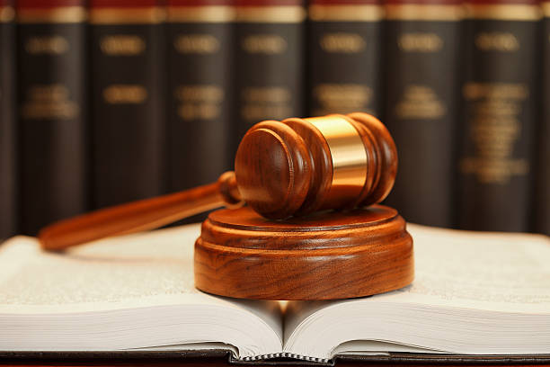istock Gavel Resting On Top Of Open Law Book 479084114