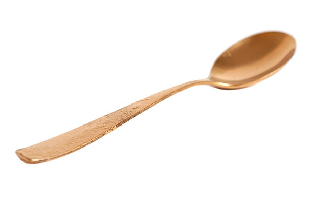 istock Golden spoon isolated on white 479084976