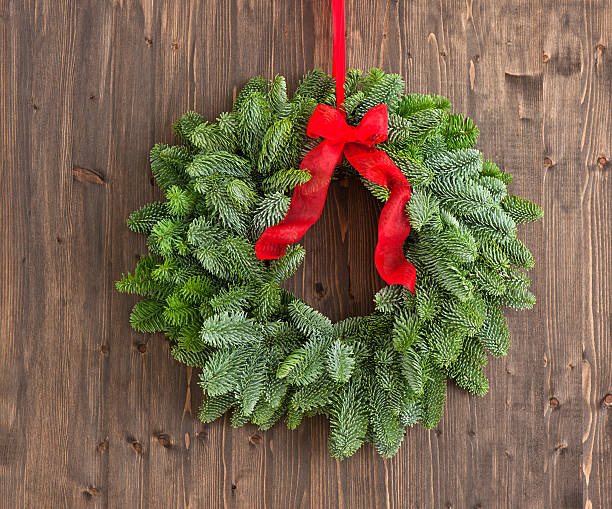 istock Advent wreath over a brown wooden plank 479087715